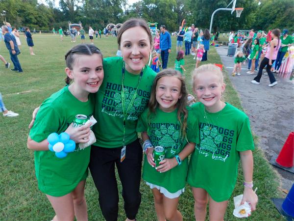 Students outside enjoying a family fun night for their school.